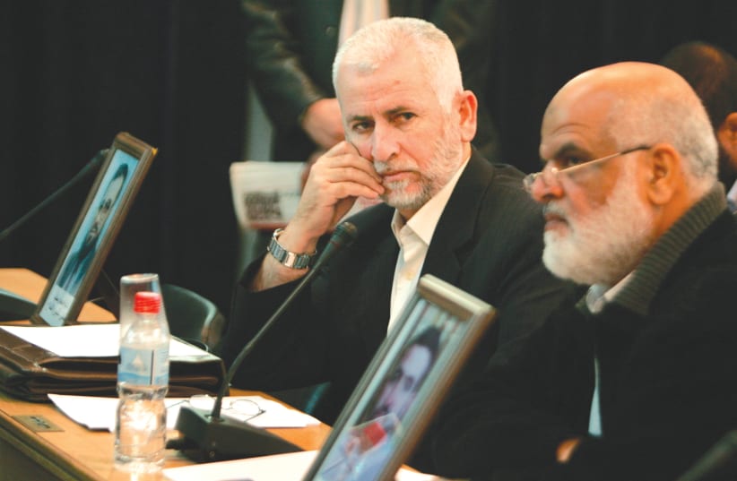  HAMAS LAWMAKERS attend a session of the Palestinian Legislative Council in Gaza, in November 2007, after the Hamas overthrow of the Palestinian Authority in the strip. (photo credit: ISMAIL ZAYDAH / REUTERS)