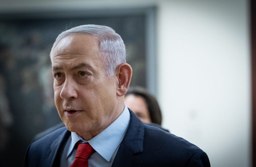 Israeli Prime Minister Benjamin Netanyahu walking outside his office at the Knesset, Israel's parliament in Jerusalem on March 13, 2024.  (photo credit: YONATAN SINDEL/FLASH90)