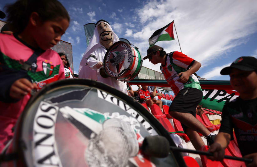 Palestino fans in the stands before the match. Palestino club was founded by Chile's Palestinian community. The club has been very active in support of the community amid the ongoing conflict between Israel and Hamas. (photo credit: REUTERS/IVAN ALVARADO)
