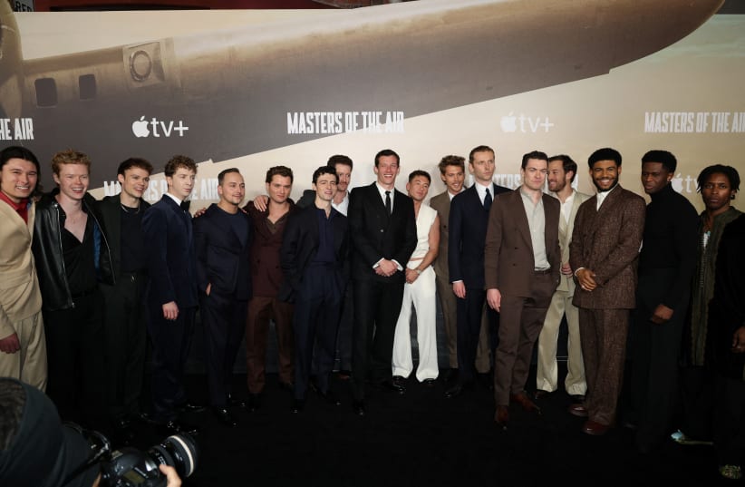 Cast members pose for a family photo during a premiere for the Apple TV+ series "Masters of the Air" in Los Angeles, California, U.S. January 10, 2024. (photo credit: REUTERS/MARIO ANZUONI)