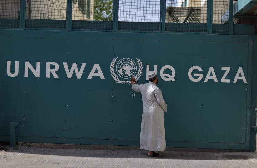  A Palestinian man waits outside of the UNRWA headquarters building in Gaza City on April 6, 2013. (photo credit: Wissam Nassar/Flash90.)