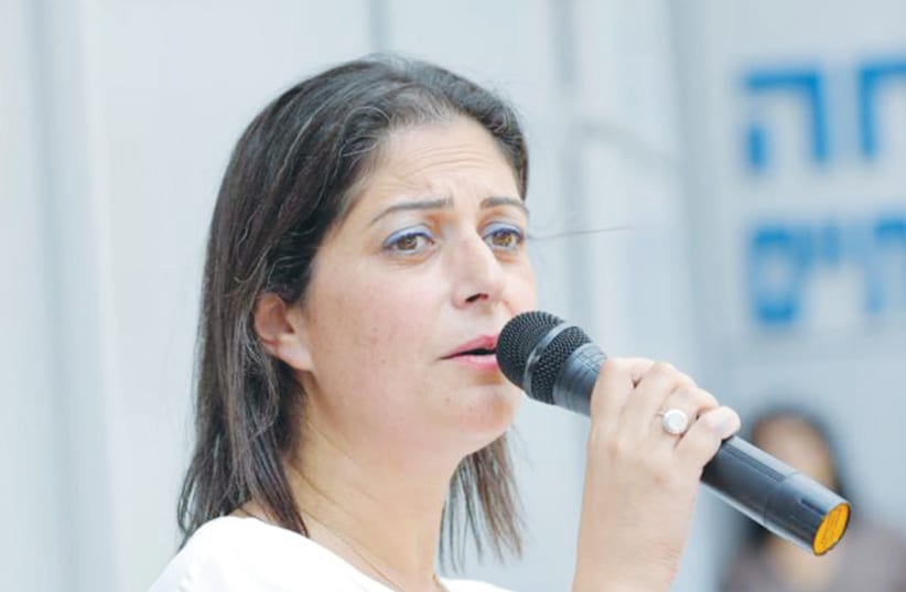  THE WRITER addresses a gathering. ‘I have never been more proud to be a social worker and a public worker,’ she says. (photo credit: Hadera Municipality)