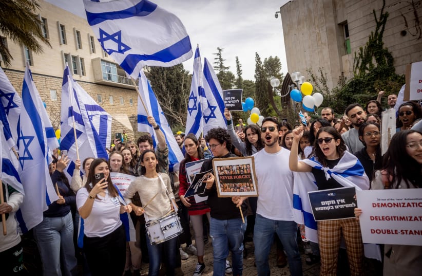  Students at Hebrew University in Jerusalem attend a rally in support of the IDF and the defense and security of Israel, as well as protest against a Hebrew U professor who had created a petition against Israel and minimized and denied the horrors of the October 7 massacre by Hamas. March 17, 2024.  (photo credit: Chaim Goldberg/Flash90)