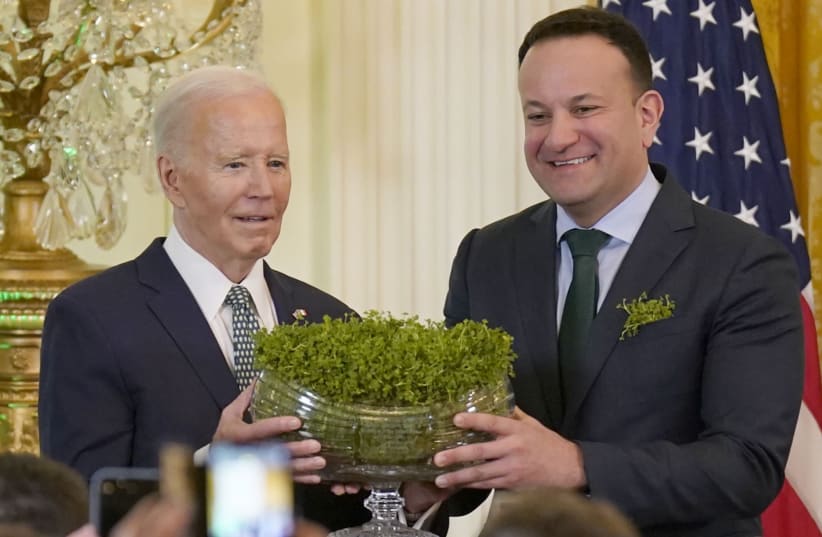 Taoiseach Leo Varadkar and US President Joe Biden during the St Patrick's Day Reception and Shamrock Ceremony in the the East Room of the White House, March 17, 2024.  (photo credit: NIALL CARSON/PA IMAGES VIA GETTY IMAGES)