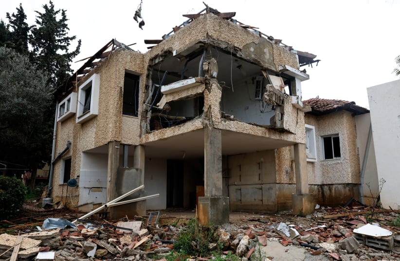 The exterior of a house damaged by a rocket fired by Hezbollah in Lebanon, amid ongoing cross-border hostilities between Hezbollah and Israeli forces, near Israel’s border with Lebanon in northern Israel. March 19, 2024. (photo credit: CARLOS GARCIA RAWLINS/REUTERS)