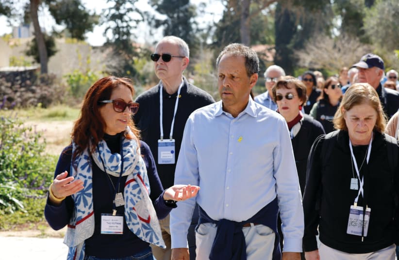  THE WRITER participates in a tour of Kibbutz Nir Oz led by Tali Roitman, who is originally from the kibbutz and now heads The Jewish Agency’s Partnership2Gether program in the Eshkol Region.  (photo credit: GUY YECHIELY)