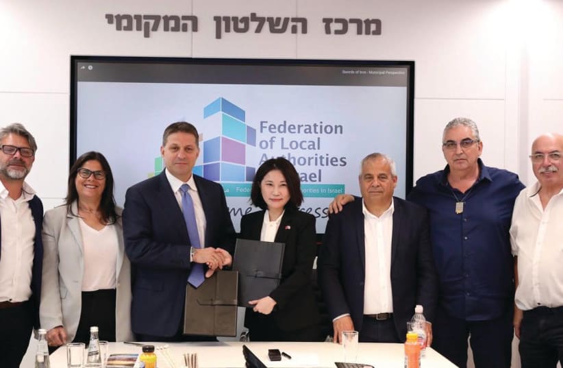  HAIM BIBAS (third left) with Abby Yapping Lee (fourth left), following the signing of a memorandum of understanding regarding Taiwan’s gift to the Federation of Local Authorities in Israel. (photo credit: Michal Shela)