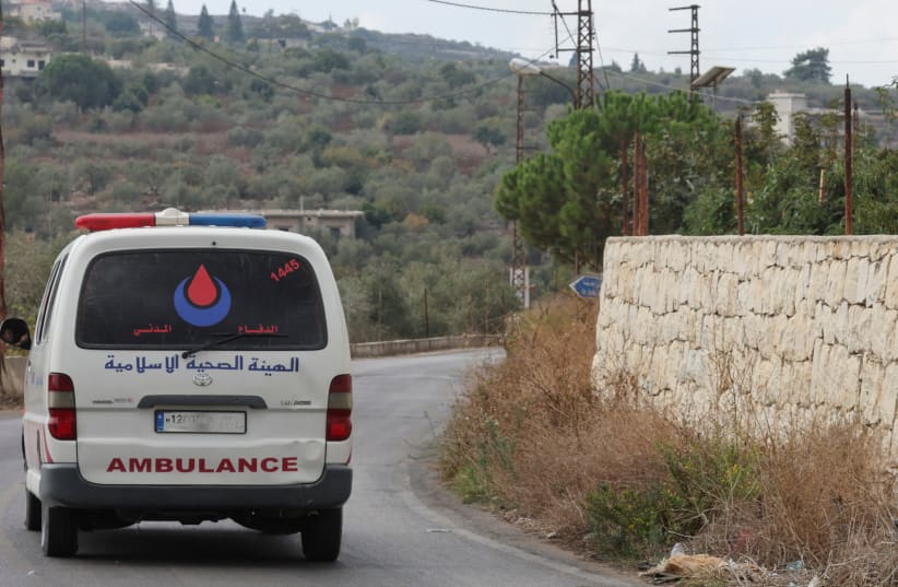  An ambulance drives in the village of Dhayra, near the border with Israel, in southern Lebanon, October 11, 2023. (photo credit: MOHAMED AZAKIR/REUTERS)
