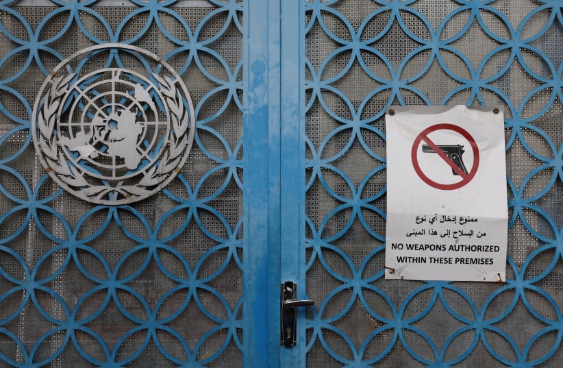 La puerta de la escuela de la UNRWA en el campo de refugiados de Aida en Belén, Cisjordania, el 5 de febrero de 2024. (photo credit: REUTERS/MUSSA QAWASMA)