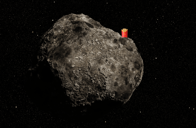  An illustrative image of McDonald's French fries atop an asteroid in space. (photo credit: dottedhippo/Getty Images, Africa images via Canva)
