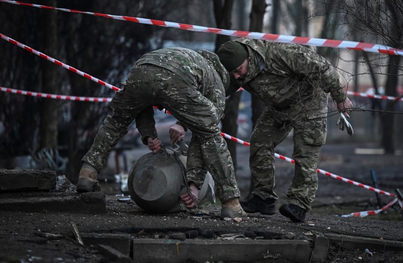  Members of a bomb squad work next to a part of a missile after a Russian missile attack, amid Russia's attack on Ukraine, in Kyiv, Ukraine March 21, 2024. (photo credit: REUTERS/Viacheslav Ratynskyi)