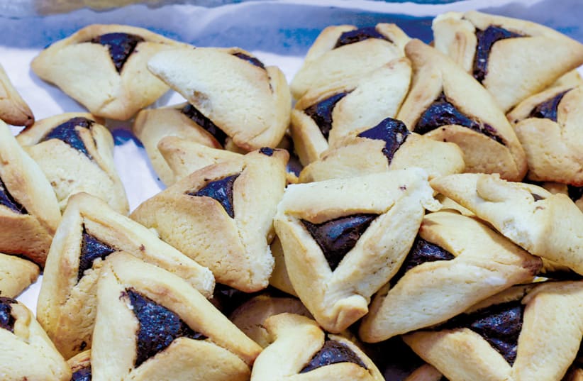  Purim bakery treat hamantaschen seen at the Madganit Pe'er bakery in Jeruasalem's Mahane Yehuda market. (photo credit: MARC ISRAEL SELLEM)