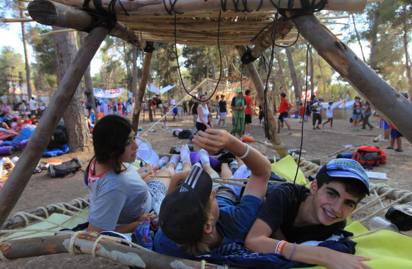  The "Tzofim"- young Israeli scouts, play at    a summer camp in the Haruvit forest near Kfar Menahem on July 7 2009. (Illustrative of American Jewish summer camps.) (photo credit: NATI SHOHAT/FLASH90)