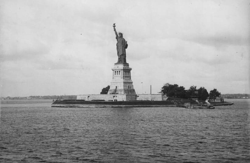  THE STATUE of Liberty in New York Harbor, 1893. ‘The New Colossus’ by poet Emma Lazarus is mounted on the statue’s pedestal.  (photo credit: Loeffler/Fox Photos/Getty Images)