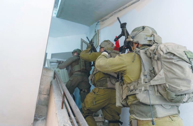  IDF SOLDIERS operate in Gaza this week. ‘Jews and Israelis should understand their current strategic straits as ordained trials meant to be tackled with wisdom and bravery, even defiance,’ the writer asserts. (photo credit: IDF/Reuters)