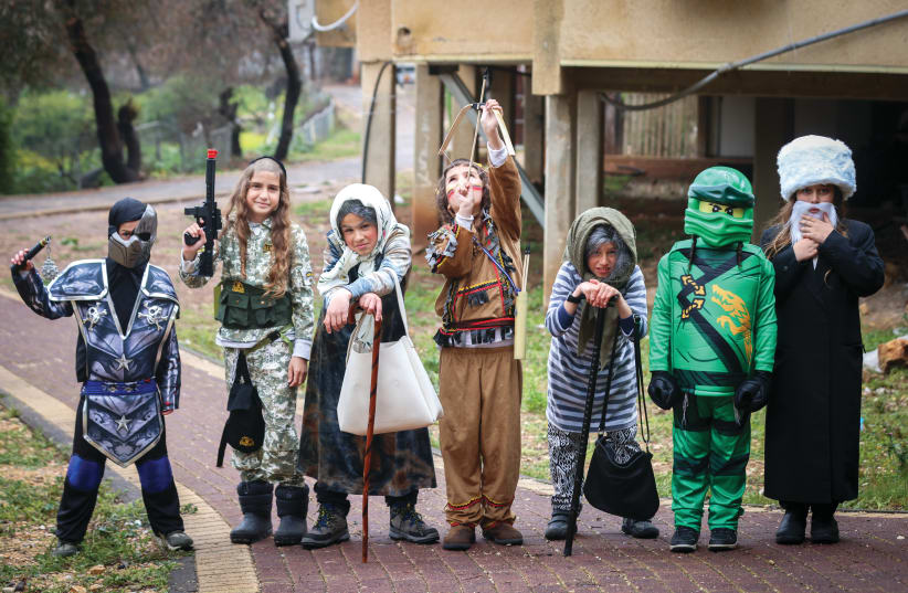  CHILDREN IN Safed dress up for Purim last week. The author writes about spending the holiday in Amman with a group of tourists. (photo credit: David Cohen/Flash90)