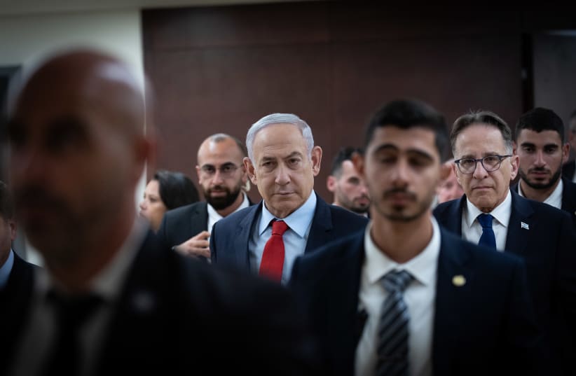 Israeli Prime Minister Benjamin Netanyahu walking outside his office at the Knesset, Israel's parliament in Jerusalem on March 13, 2024. (photo credit: YONATAN SINDEL/FLASH90)