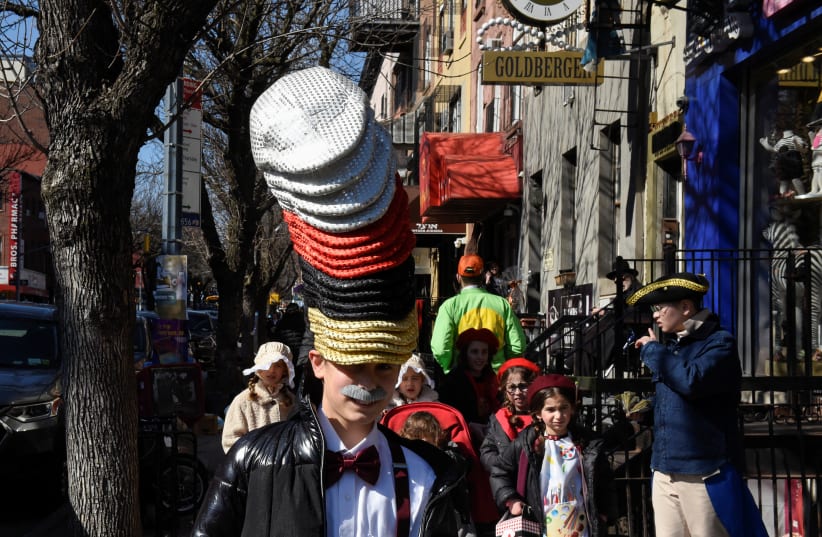  Children wear costumes during celebrations to mark the Jewish holiday of Purim, in the Brooklyn borough of New York City, U.S. March 7, 2023. (photo credit: STEPHANIE KEITH/REUTERS)