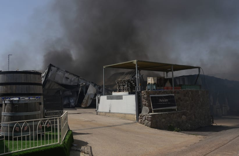  Smoke rises after a rocket fired from Lebanon hit Moshav Avivim, northern Israel, March 26, 2024. (photo credit: AYAL MARGOLIN/FLASH90)
