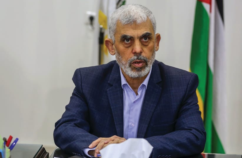  HAMAS’S GAZA chief, Yahya Sinwar, sits in his office in Gaza City, in 2022. While the majority of experts believe that Sinwar is an irrational psychopath, others consider him to be a psychopath who ultimately makes rational decisions, says the writer. (photo credit: ATTIA MUHAMMED/FLASH90)