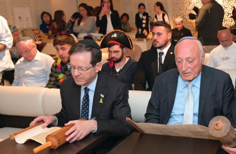  PRESIDENT ISAAC HERZOG attends the Megillah reading at the Theatron Hotel synagogue in Jerusalem. (photo credit: SHLOMI AMSALEM)
