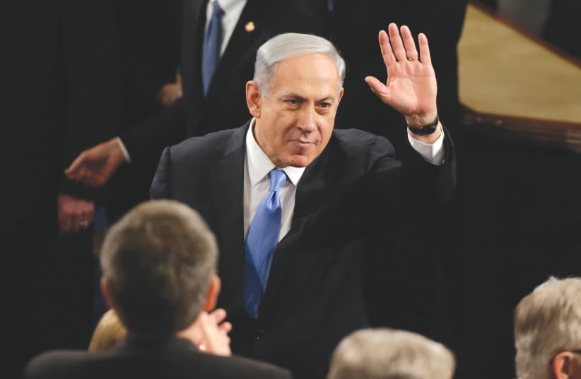 En 2015, Netanyahu desafió a la administración demócrata al hablar ante un Congreso de mayoría republicana, según el escritor. (photo credit: GARY CAMERON/REUTERS)