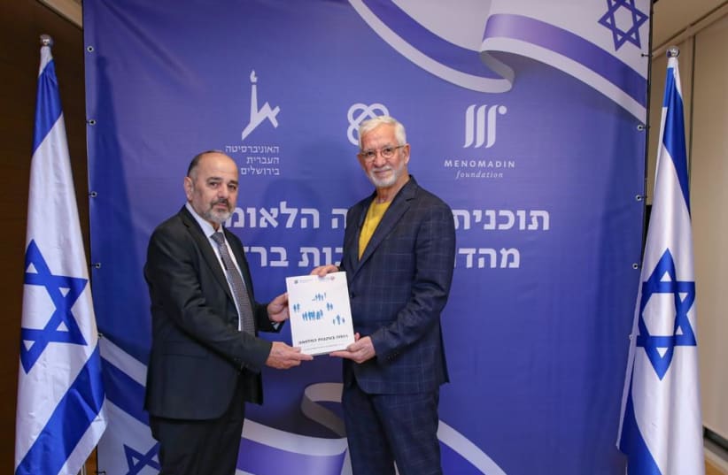  Haim Taib, President, and Founder of the Menomadin Foundation, presents report on Israeli welfare system to Minister of Welfare and Social Security Ya'akov Margi. (photo credit: ROTEM LAHAV)