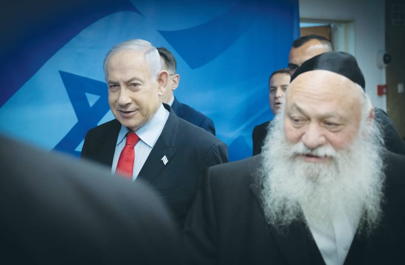 Housing Minister Yitzhak Goldknopf, leader of United Torah Judaism, arrives for a cabinet meeting together with Prime Minister Benjamin Netanyahu. (photo credit: CHAIM GOLDBEG/FLASH90)
