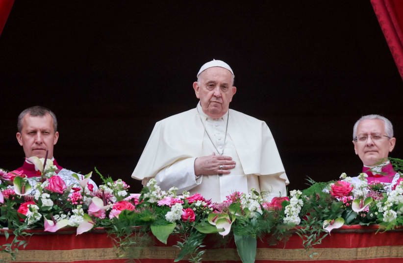  Pope Francis looks on from a balcony, on the day he delivers his "Urbi et Orbi" (To the city and the world) message at St. Peter's Square, on Easter Sunday, at the Vatican March 31, 2024. (photo credit: REUTERS)