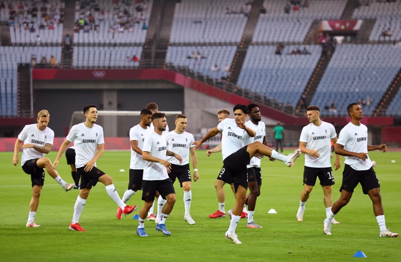  Germany players during the warm up before the match. (photo credit: REUTERS/AMR ABDALLAH DALSH)