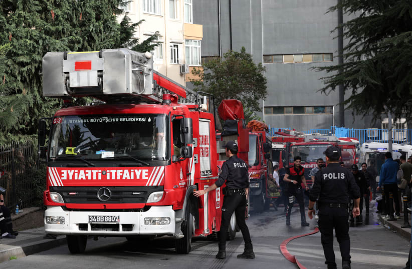 Police officers arrive the scene after a fire broke out aat a nightclub in Istanbul, Turkey April 2, 2024 (photo credit: REUTERS/MURAD SEZER)