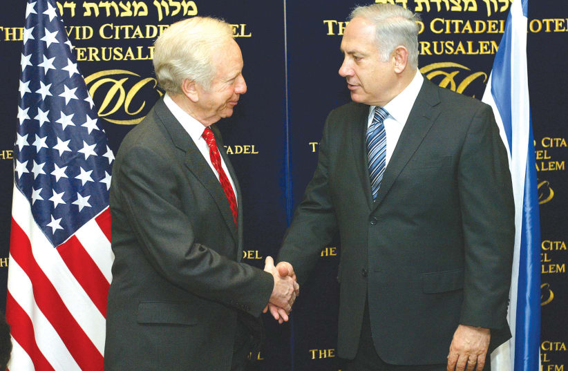  Then-US Senator Joe Lieberman meets Prime Minister Benjamin Netanyahu in Jerusalem in 2009, following a Knesset election that would soon return Netanyahu to the Prime Minister's Office. (photo credit: OLIVIER FITOUSSI/FLASH90)