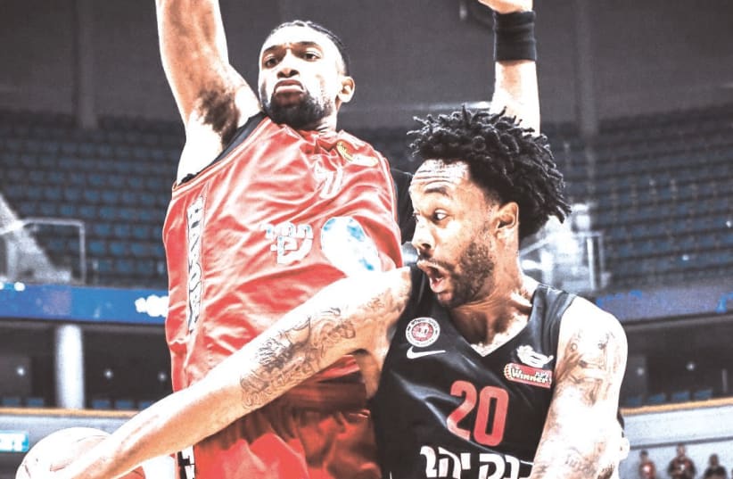 HAPOEL JERUSALEM’S Levi Randolph passes around Hapoel Tel Aviv’s Kyle Alexander during the Capital City Reds’ 84-79 State Cup quarterfinal victory over Hapoel Tel Aviv, which parted ways with coach Danny Franco (inset) after the contest. (photo credit: YEHUDA HALICKMAN)