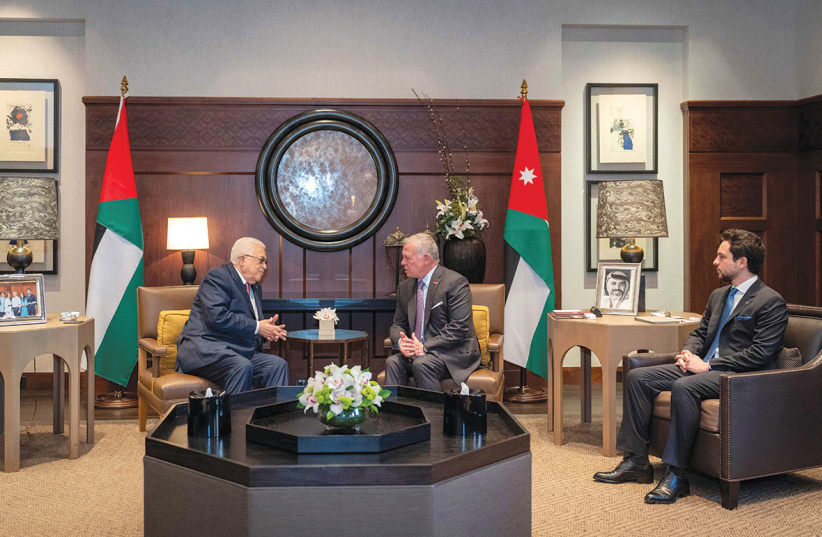  Jordan’s King Abdullah II and Crown Prince Hussein meet with Palestinian President Mahmoud Abbas in Amman, Jordan, in this handout picture released on February 25. (photo credit: Royal Hashemite Court/Handout via Reuters)