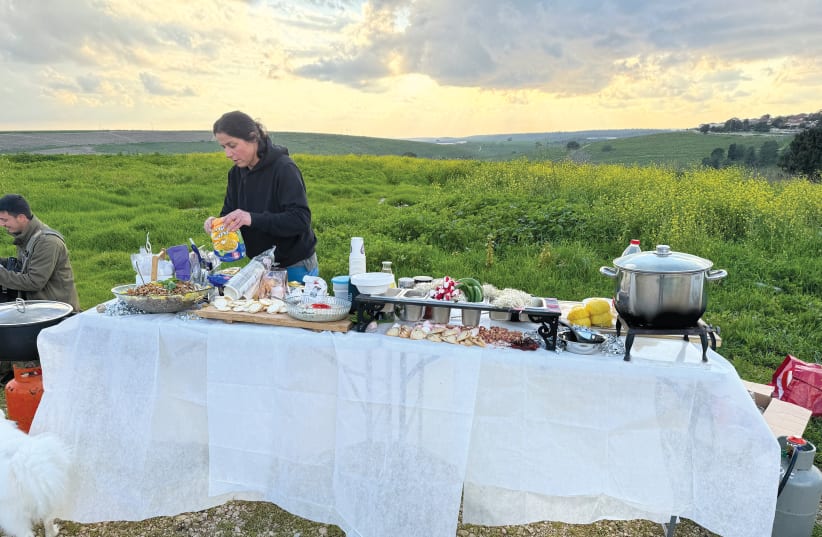  Limor Siegel prepares the food for the soldiers. (photo credit: LIMOR SIEGEL)