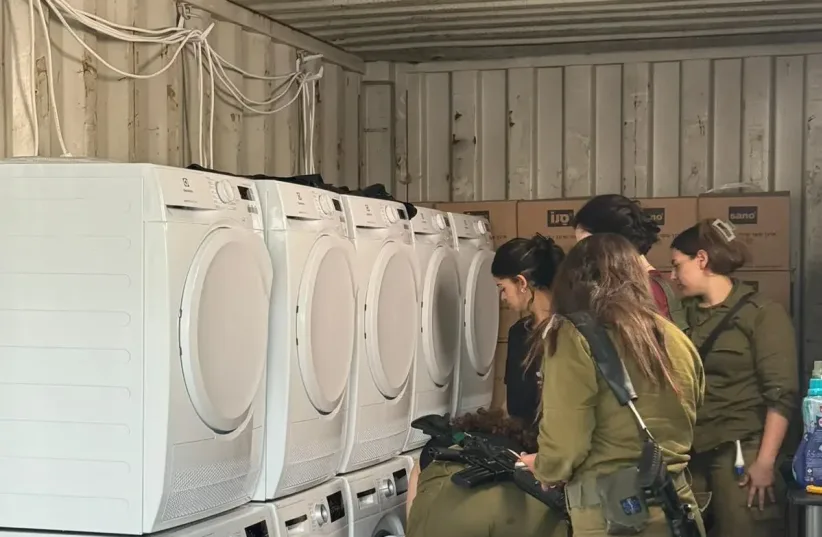  Laundry with the smell of home: Snow operates a mobile laundry for soldiers in the field (photo credit: Tal Shoval)