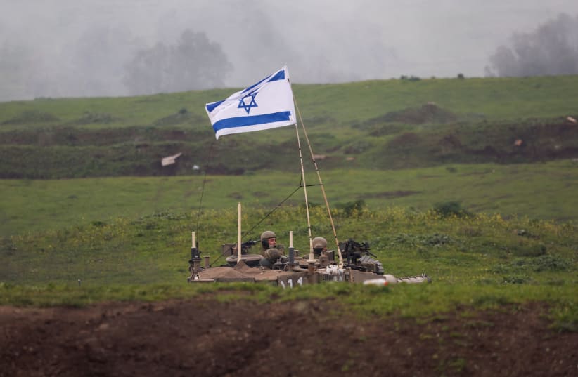  Israeli soldiers use a tank during a military drill in the Golan Heights, February 20, 2024 (photo credit: REUTERS/AMIR COHEN)