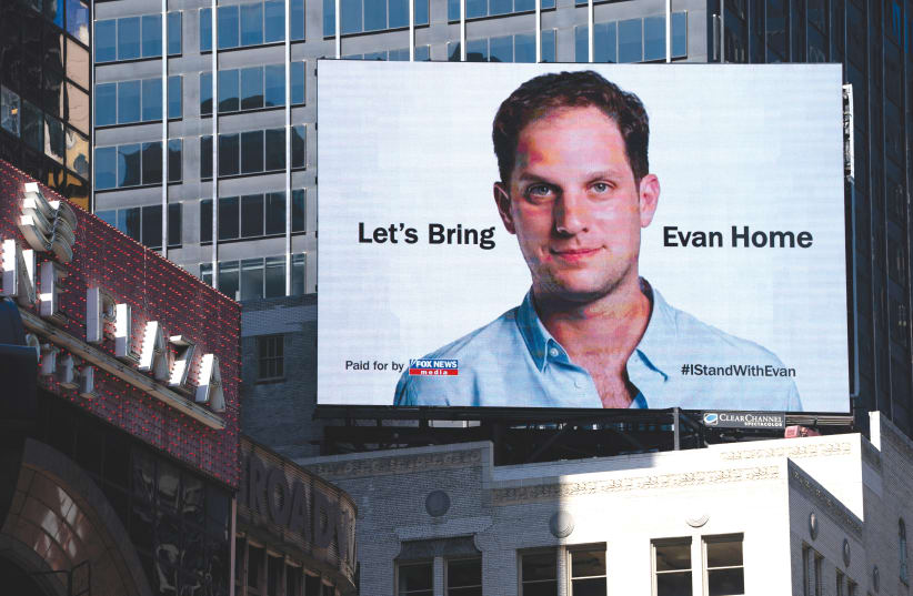  ONE YEAR since Evan Gershkovich’s arrest, a billboard advertisement in New York City calls for the release of the ‘Wall Street Journal’ reporter held in Russia. (photo credit: David ‘Dee’ Delgado/Reuters)