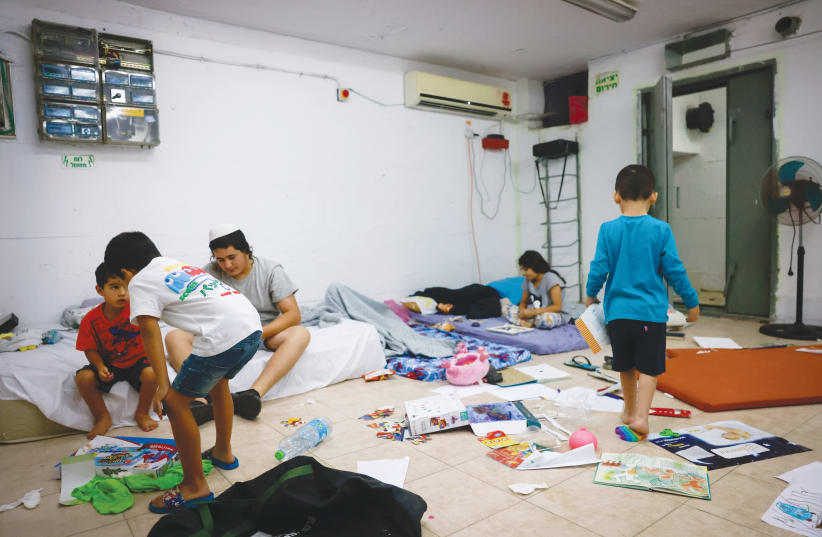  Israeli children in an Ashkelon bomb shelter, October 8, 2024, just one day after the October 7 massacre. (photo credit: FLASH90)