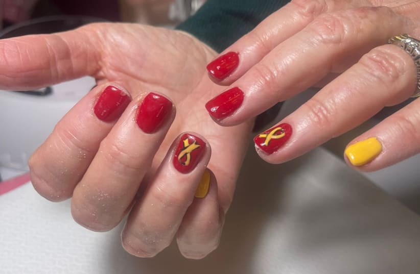  Yellow-adorned nails in memory of the hostages held in Gaza and those murdered by Hamas. (photo credit: COURTESY BARBARA SOFER)