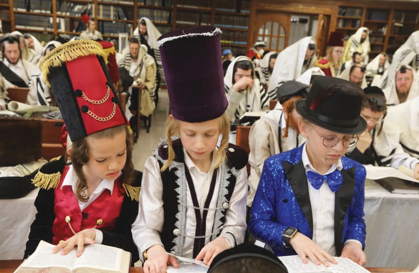  ULTRA-ORTHODOX CHILDREN follow a Scroll of Esther reading in Beit Shemesh (photo credit: FLASH90)