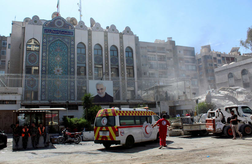  An ambulance is parked outside the Iranian embassy after a suspected Israeli strike on Monday on Iran's consulate, which Iran said had killed seven military personnel Damascus, Syria April 2, 2024.  (photo credit: FIRAS MAKDESI/REUTERS)