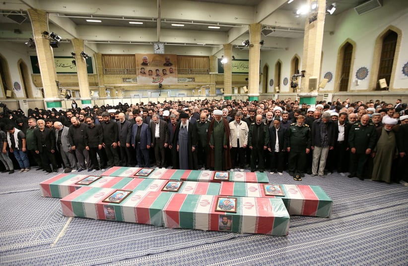  Iran's Supreme Leader, Ayatollah Ali Khamenei pray next to the Coffins of members of the Islamic Revolutionary Guard Corps who were killed in the airstrike on the Iranian embassy complex in the Syrian capital Damascus, during a funeral ceremony in Tehran, Iran April 4, 2024. (photo credit: Office of the Iranian Supreme Leader/WANA (West Asia News Agency)/Handout via REUTERS)