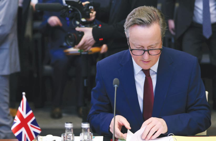  BRITISH FOREIGN SECRETARY David Cameron takes part in a NATO meeting in Brussels, last week. ‘The Iranian regime and the criminal gangs who operate on its behalf pose an unacceptable threat to the UK’s security,’ he says. (photo credit: JOHANNA GERON/REUTERS)