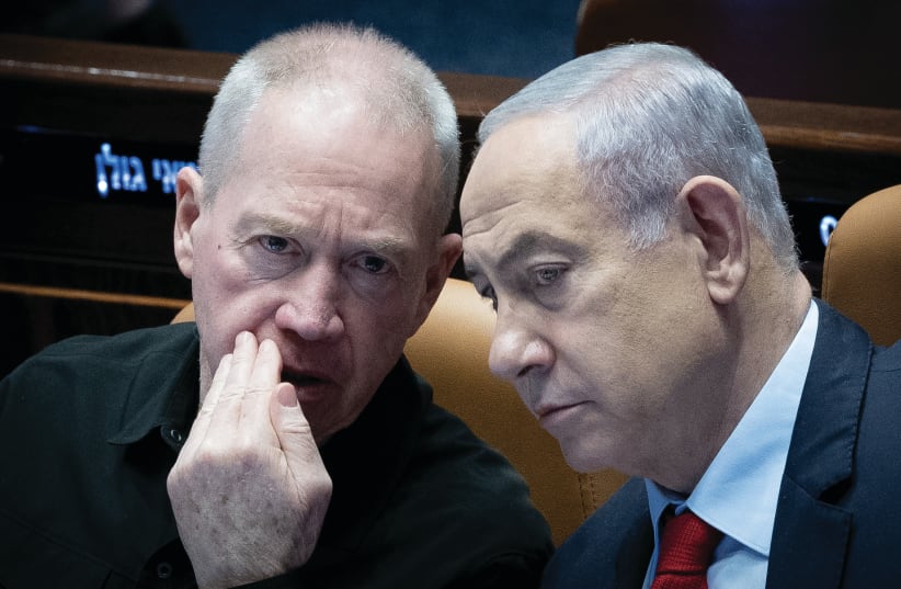  PRIME MINISTER Benjamin Netanyahu and Defense Minister Yoav Gallant confer in the Knesset plenum last month. Many Israelis are thirsty for a decisive Israeli victory and a long-term strategy in order to finally live in peace and without existential threat, the writer asserts.  (photo credit: YONATAN SINDEL/FLASH90)