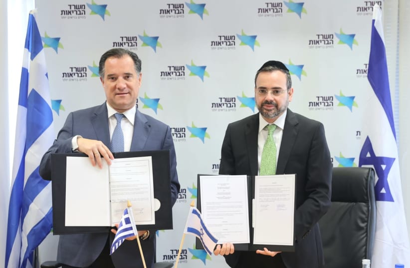  Greek Health Minister Adonis Georgiadis and his Israeli counterpart MK Uriel Busso sign an agreement. April 8, 2024. (photo credit: MIRI SHIMONOVICH/GPO)