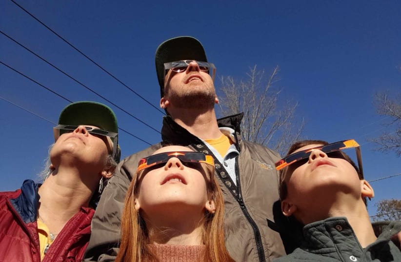  THE CLUCHEY FAMILY views the 'path of totality' in Millinocket, Maine on Monday, April 8, 2024. (photo credit: Rose Cluchey)