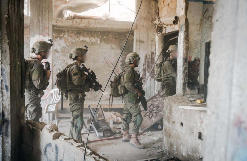 IDF soldiers from the Nahal Brigade operate in the central Gaza Strip, April 10, 2024 (photo credit: IDF SPOKESPERSON'S UNIT)