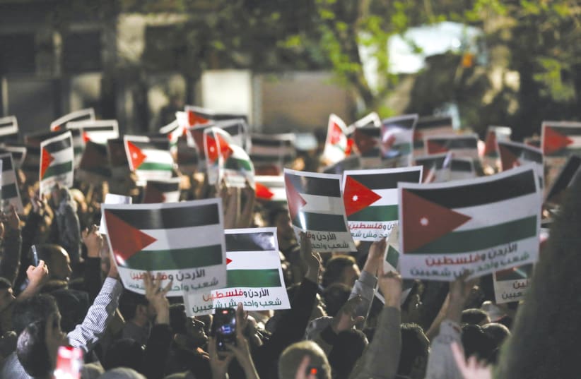  A DEMONSTRATION in support of the Palestinians in Gaza is held near the Israel Embassy in Amman, last weekend. Incitement against Israel and the US spurs the Jordanian public to attack the Jordanian regime, if it adopts a policy that reflects cooperation with one of them, says the writer.  (photo credit: Alaa Al-Sukhni/Reuters)