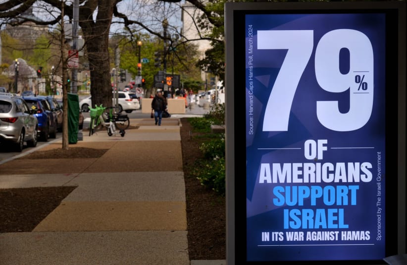  A sign that went up at a bus stop in Washington DC regarding the Israel-Hamas war. (photo credit: Israeli National Information System)